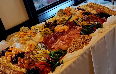 Large charcuterie table set up at an event